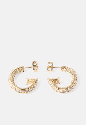 Gold hoop earrings featuring a curved design, embellished with clear crystals along the outer edge. Secure post-back closure.