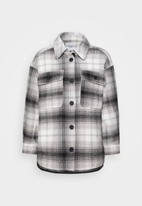 Black and white plaid shirt jacket featuring a button-up front, two chest pockets, and a relaxed fit. Soft fabric with a structured design.