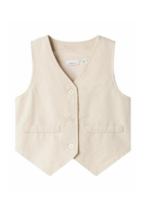 Beige cotton vest with a v-neckline, five buttons, and two front pockets. Smooth texture with a tailored shape and pointed hemline.