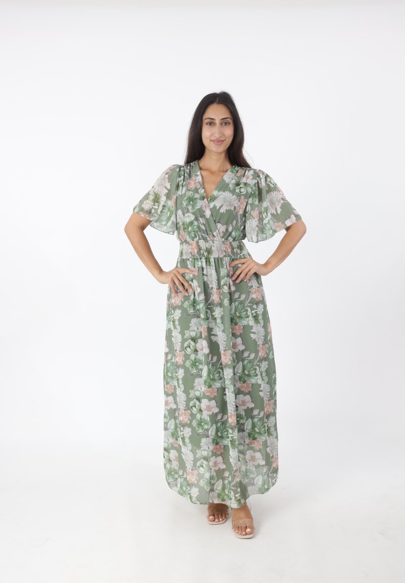 Maxi-jurk met een groen bloemenpatroon, korte pofmouwen, een v-hals en een gestikte taille. Doorzichtige, lichtgewicht stof met een vloeiende silhouet.