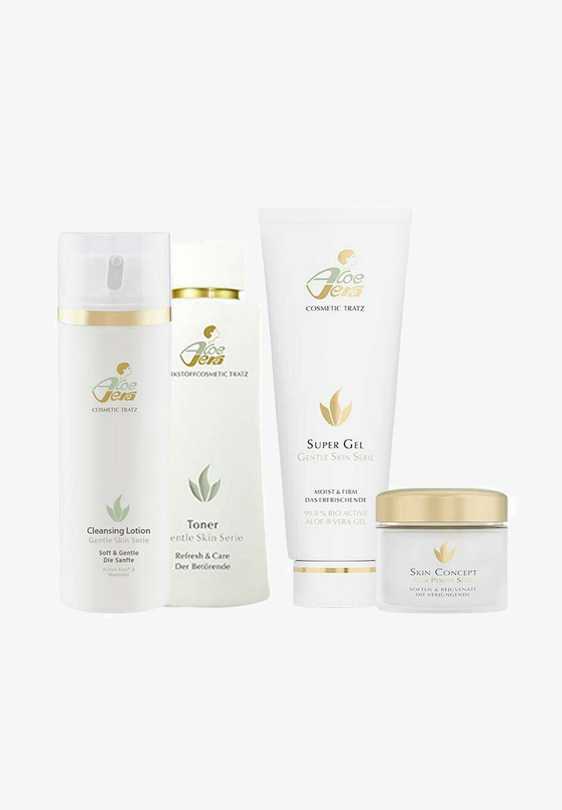 Four skincare products in white packaging with gold accents: a cleansing lotion, toner, super gel, and skin concept cream, featuring plant logos.