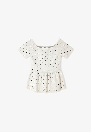 Haut blanc à manches courtes style péplum avec des pois noirs, encolure carrée et détail froncé à la taille.