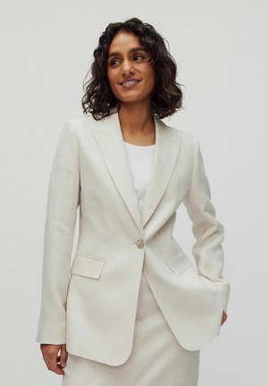 Off-white skräddarsydd blazer i linnetyg med slagkrage, enkel knappstängning och framfickor. Svilgande struktur och väldefinierad silhuett.