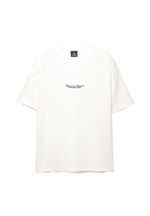 T-shirt en coton blanc avec un col rond et des manches courtes. Le devant affiche le texte "Maître des Maîtres" en bleu marine.