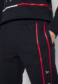 Tommy Hilfiger Träningsbyxor - dark blue