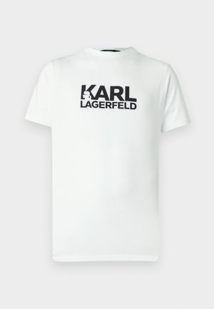 Hvit bomulls-T-skjorte med stort svart grafisk trykk som sier "KARL LAGERFELD." Rund hals og korte ermer. Glatt tekstur.