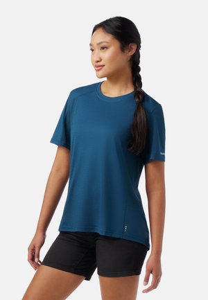Blue short-sleeve t-shirt made from a smooth, lightweight fabric. Features a rounded neckline, mesh accents, and a subtle hem detail.
