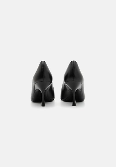 Black leather high-heeled shoes with a pointed toe and a slim stiletto heel. Smooth texture with minimal stitching details.