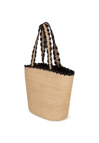 Austa salmu somiņa ar melnu mežģīņu apdari augšā. Aprīkota ar divām austām siksnām gaismā un tumšā tonī ērtai nēsāšanai.