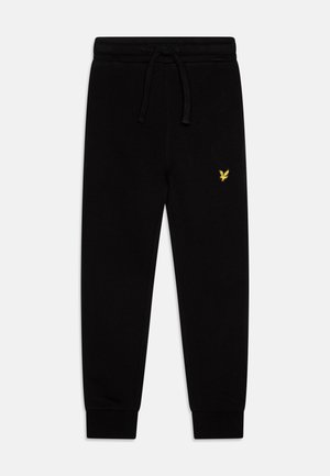 Pantaloni jogging neri con una vestibilità rilassata, realizzati in morbido tessuto. Presentano una vita elasticizzata con cordoncino e polsini a costine. Dettaglio del logo dorato.