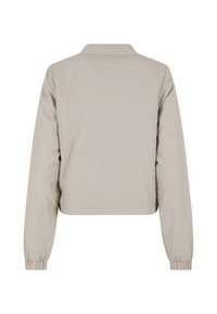 Beige zkrácená bunda s límečkem, dlouhými rukávy a elastickými manžetami. Hladká textura, minimalistický design bez viditelných zapínání.
