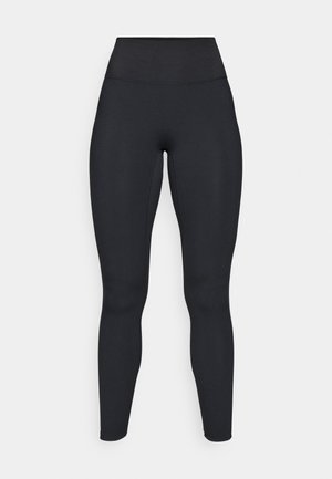 Black leggings with a high waistband, made from a smooth, stretchy material. Features a fitted design, tapering at the ankle.
