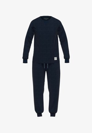 Navy blauwe loungewear set gemaakt van textuurstof; met een lange mouwen top met een V-hals en bijpassende elastische joggingbroek.