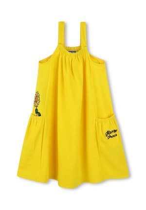 Yellow cotton dress with wide straps, gathered bodice, two side pockets, embroidered sunflower detail, and "Kenzo Paris" text accent.
