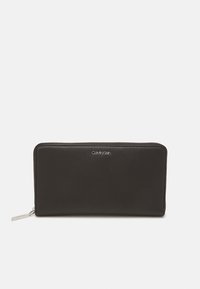 Black leather wallet with a smooth texture, rectangular shape, zip closure, and a silver logo on the front. Compact and minimalist design.