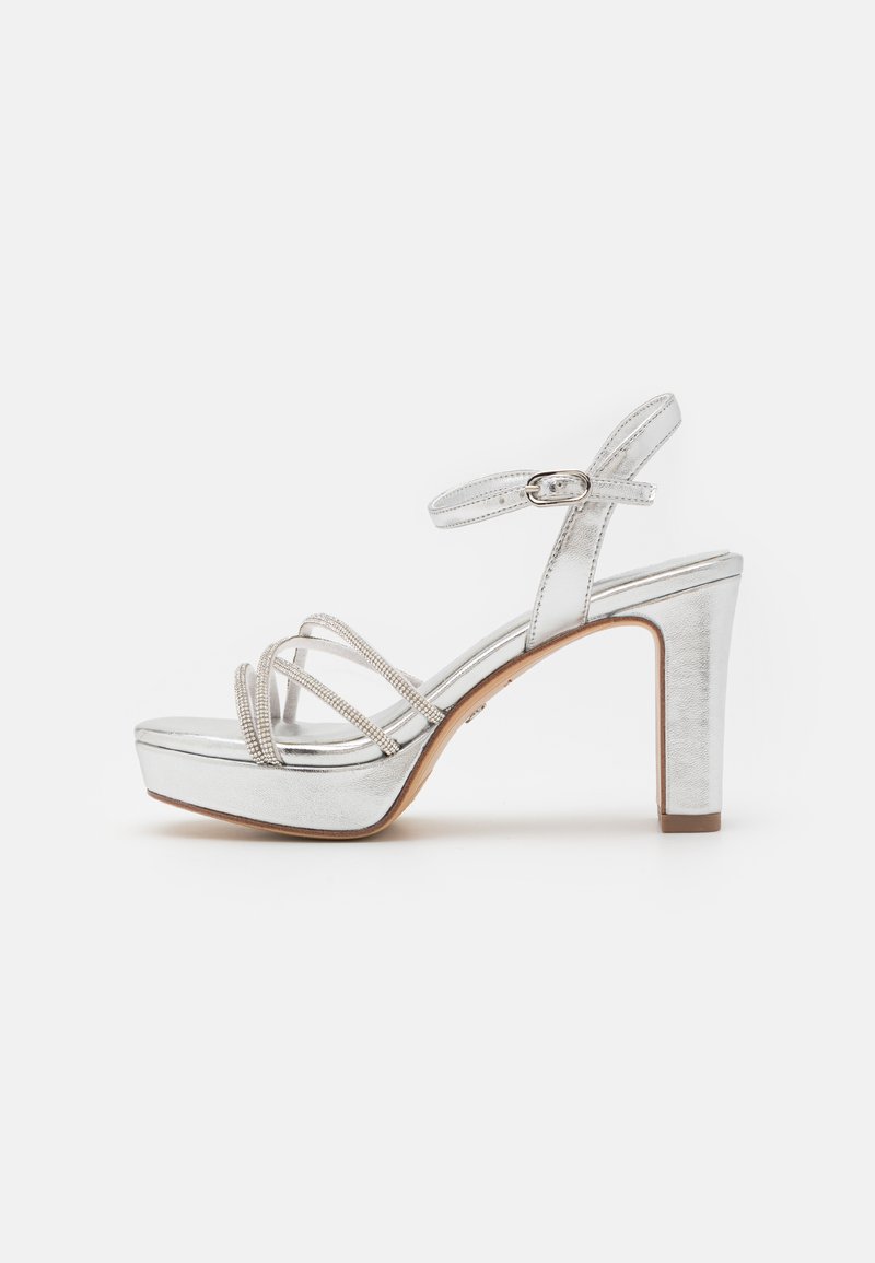 Silver high-heeled sandals with a platform, featuring thin straps adorned with small embellishments and a buckle closure on the ankle.