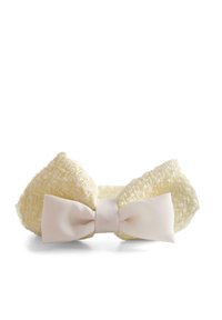 Żółta, teksturowana opaska na głowę z dużą, miękką kokardą w jasnoróżowym materiale. Materiał ma plecioną strukturę, co nadaje ręcznie wykonany wygląd.