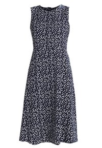 Marinblå ärmlös klänning med en figurnära bodice och utsvängd kjol, med ett vitt abstrakt prickmönster och en rund halsringning.