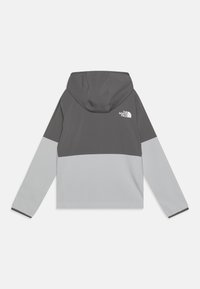 Giacca color block grigia e grigio chiaro con cappuccio. Presenta il logo sulla parte superiore della schiena e polsini elastici. Tessuto morbido e leggero.