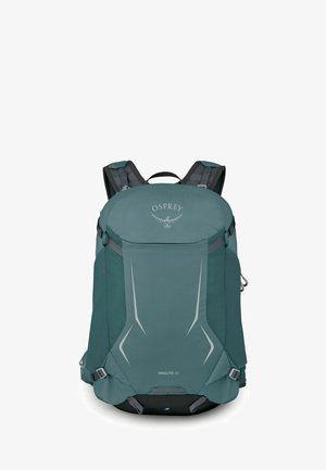 Sac à dos de randonnée Teal Osprey Hikelite 28 avec bretelles rembourrées, détails réfléchissants à l'avant et sangles de compression latérales.