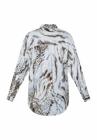 Langærmet skjorte i let stof med hvid bundfarve, prydet med grå og brun dyreprint. Oversize pasform med detalje i ryggen.