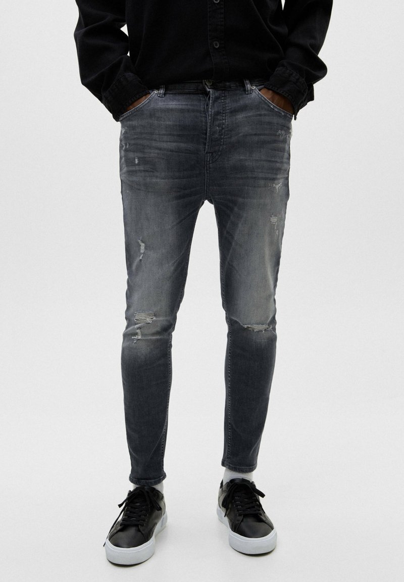 PULL&BEAR RIPPED CARROT Slim fit jeans dark grey Zalando.de
