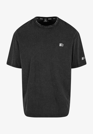 Svart bomull T-skjorte med rund hals, korte ermer og en liten hvit logo på brystet. Myk tekstur med en avslappet passform.