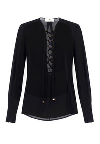 Blusa negra de manga larga con escote con cordones, que presenta acentos de hardware dorado y una textura de tela suave. Siete redondeado y corte ajustado.