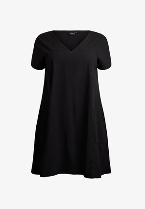 Musta lyhythihainen mekko, jossa V-aukko, valmistettu teksturoidusta kankaasta, väljällä istuvuudella ja kahdella sivutaskulla. Pyöreä helmaresu.