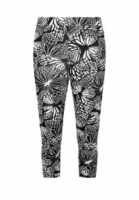 Svart- och vita tights med ett fjärils mönster, med en tät passform och slät textur. Lämpliga för avslappnad användning eller aktivt bruk.