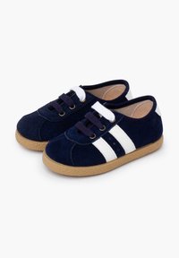 Navy blue suede sneakers featuring white stripes, tan rubber sole, lace-up design, and soft interior lining for comfort.