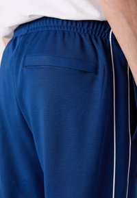 Lacoste Tepláky - globe
