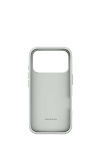 Jasnozielone etui na telefon z prostokątnym wycięciem u góry, wykonane z gładkiego silikonu. Na dole znajduje się logo "Swarovski".