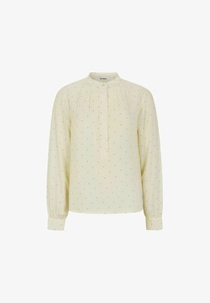 Világos sárga blúz hosszú ujjakkal, redőzött elülső résszel, mandarin gallérral és fekete pöttyös mintával. Puha, sima szövettextúra.