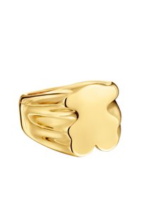 Anello d'oro con una finitura liscia e lucida, caratterizzato da una parte superiore a forma di quadrifoglio e un design della fascia curva per comfort e stile.