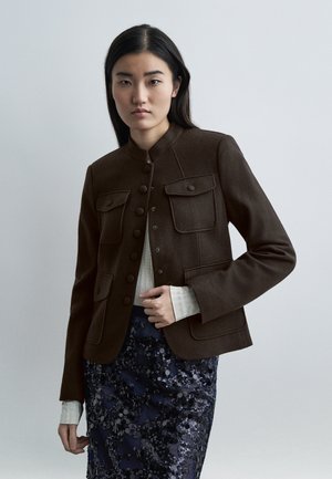 - Kurtka przejściowa