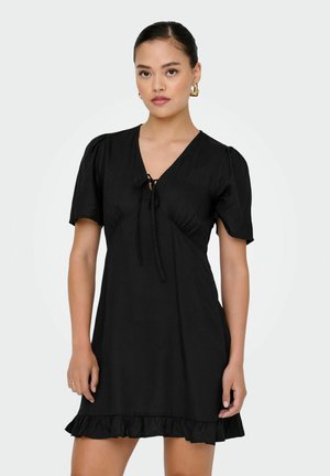 Black short dress with puff sleeves, V-neckline, tie detail at the bust, and a ruffled hem. Smooth fabric and relaxed fit.