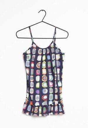 Sleeveless dark top with multicolored oval patterns, gathered neckline, and ruffled hem. Fabric is lightweight and stretchy.