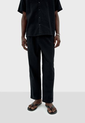 LUC - Stoffhose - black
