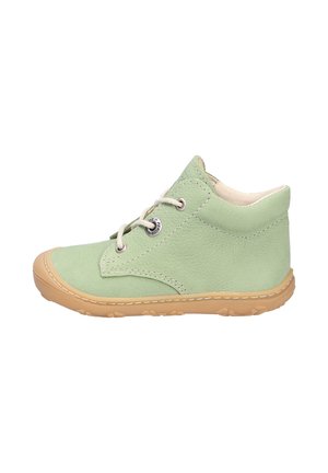 Green leather ankle boot with beige rubber sole, featuring a rounded toe, lace-up front, and simple stitching detail. Minimalist design.