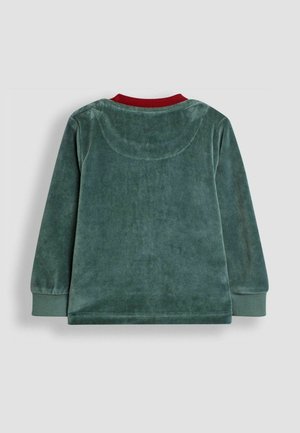 Cămașă lungă cu mâneci din velur verde, cu guler rotund și manșete ribbed roșii. Prezintă o textură netedă și manșete ajustate.