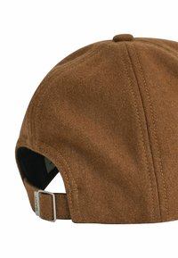 Brown suede cap with a rounded top, visible stitching, and an adjustable strap featuring a metal buckle, showcasing a soft texture.