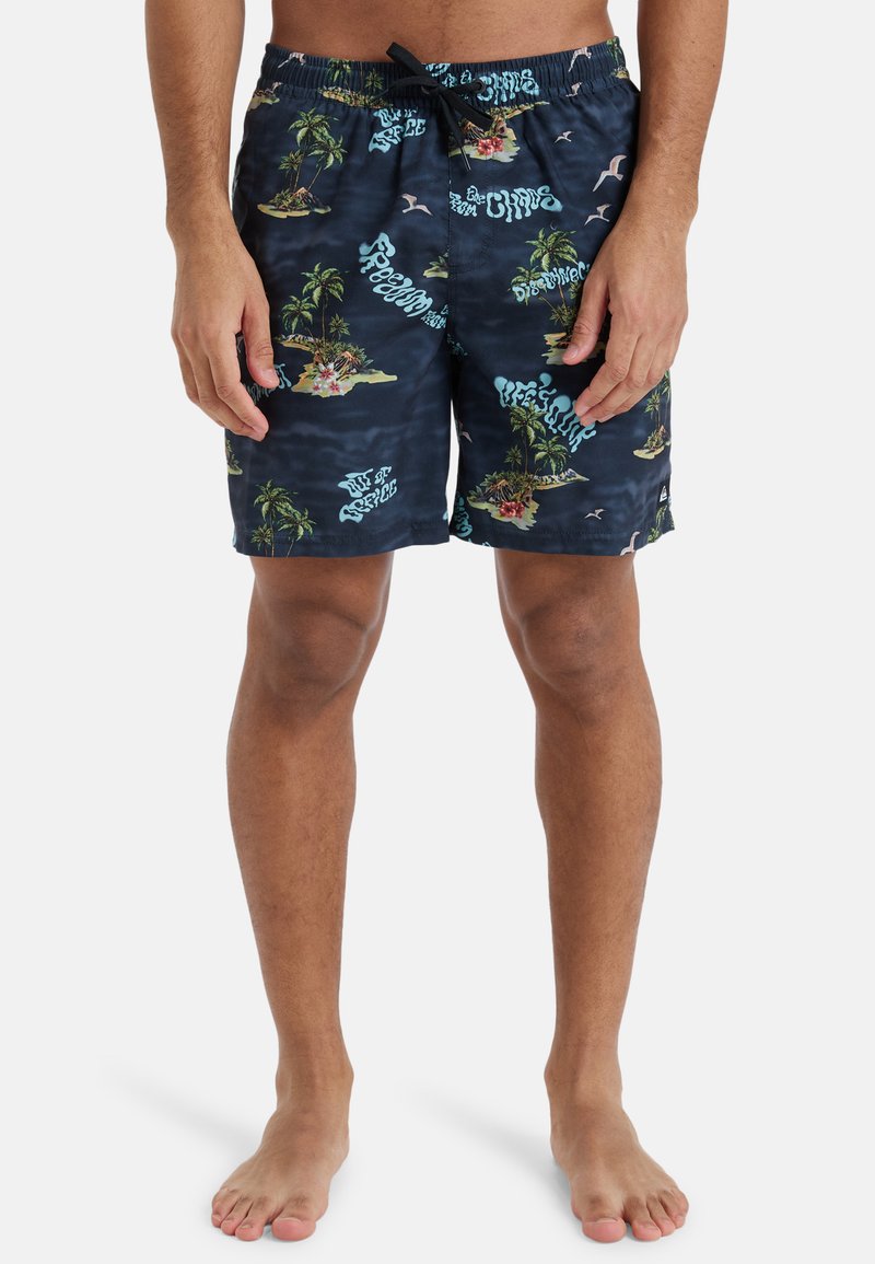 Navy swim shorts with a tropical island print, featuring palm trees, flowers, and text accents. Made from lightweight, quick-drying fabric.