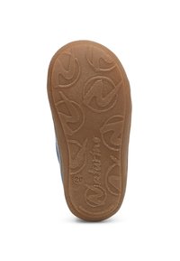 Gumová podrážka v světle hnědé barvě s texturovaným povrchem, obsahující kruhové vzory a vyražené jméno značky.