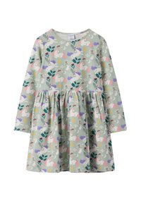 Lasten pitkähihaisessa mekossa on mintunvihreä tausta, jossa on yksisarvisia, jäniksiä, kukkia, lehtiä, kuu, tähtiä ja aurinkolasien kuvasto.