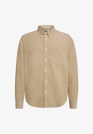 Bež košulja dugih rukava na dugme od mekane tkanine. Ima džep na grudima i zaobljen rub. Opremljena je bijelim dugmadima i kragnom.