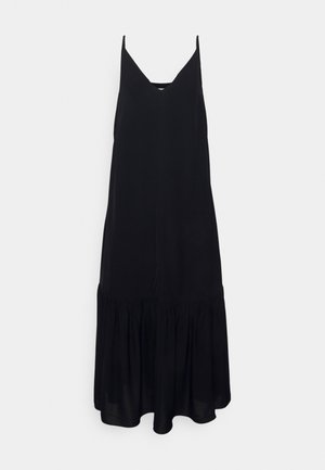 Vestido midi negro sin mangas con escote en V y dobladillo fruncido con volantes sobre un fondo claro.
