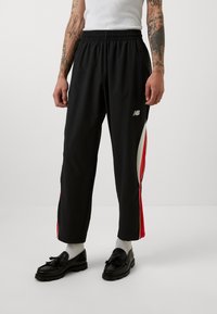 New Balance IN GAME - Pantalon de survêtement - black