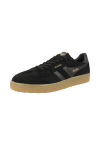Black suede sneakers with black leather accents, rubber sole, and gold logo. Features flat laces and two side stripes. Classic athletic design.