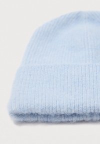 Light blue soft knit wool beanie hat with a folded brim, displayed on a plain white background.
